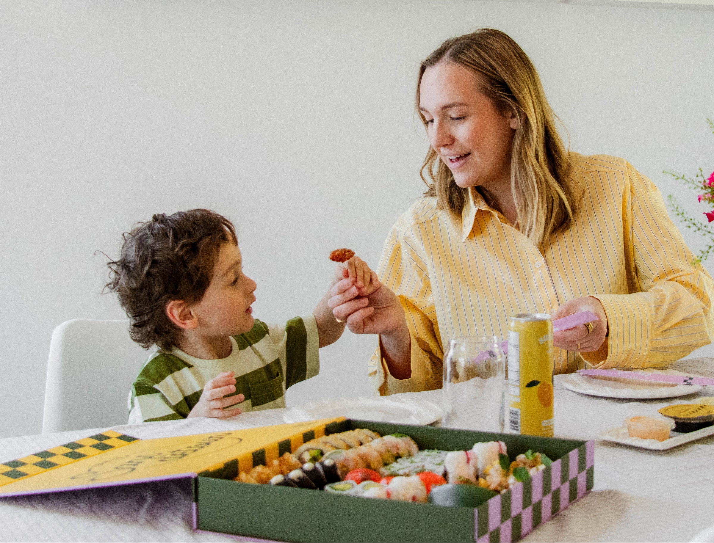 Family preparing sushi in the kitchen